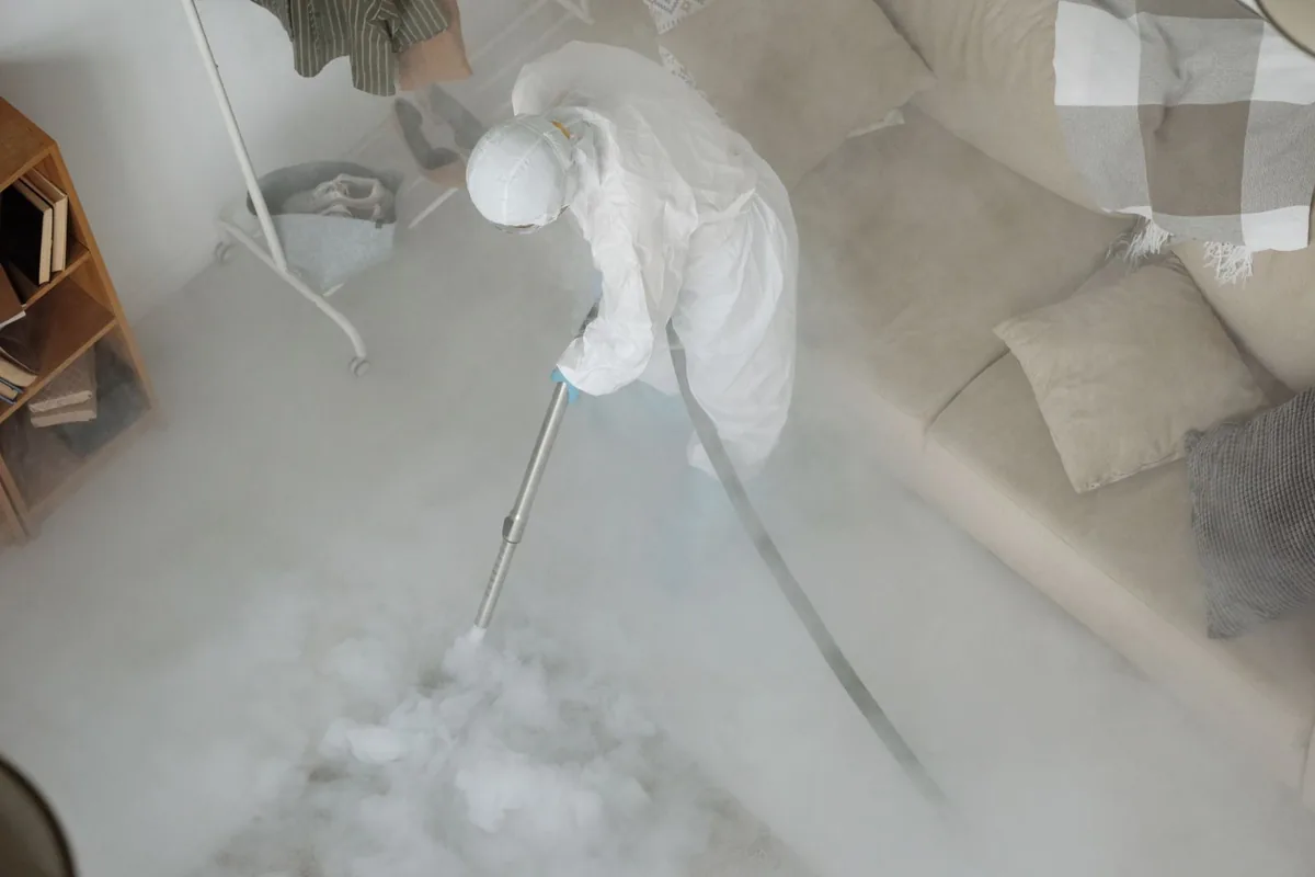 Biohazard cleanup technician in protective equipment, San Diego, CA